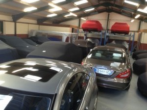 Luxury cars in storage at Classic Car Storage UK facilities. 