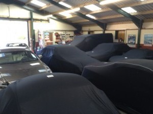 Cars under car covers at Classic Car Storage UK storage facilities.  