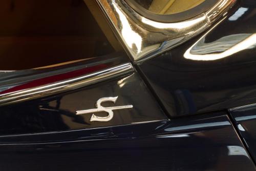 Side shot of a vintage car in storage at Classic Car Storage. 