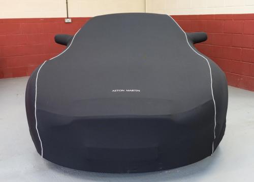 Classic Aston Martin under an Aston Martin car cover at Classic Car Storage UK. 