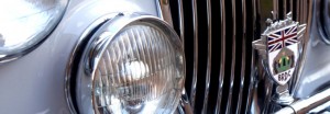 BRDC badge fitted to the grill of a vintage car. 